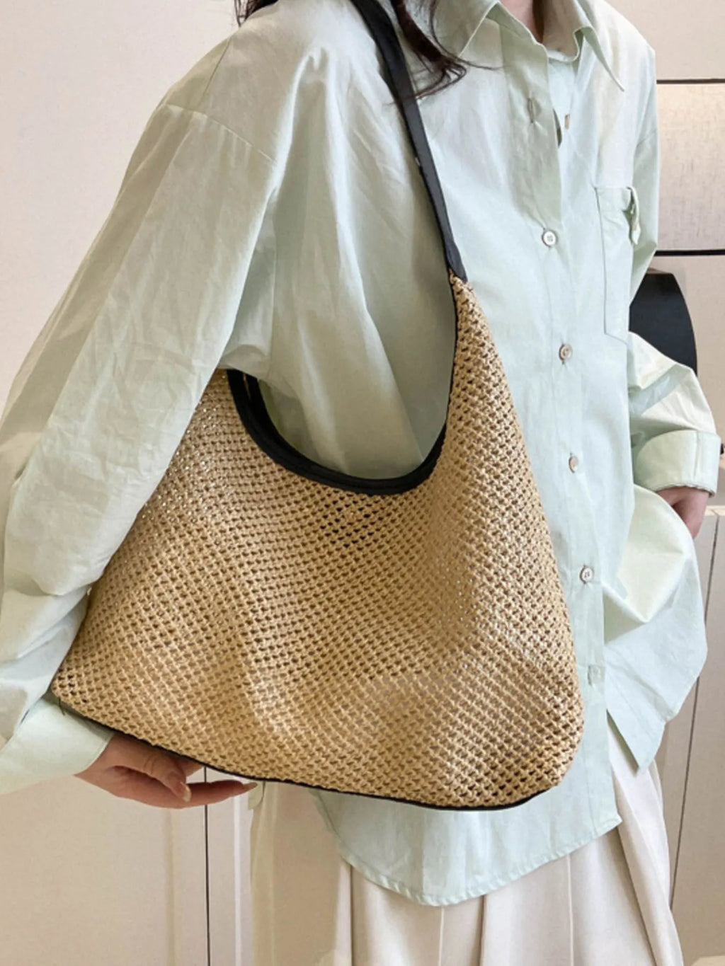 Woven Straw Shoulder Bag on shoulder with white shirt