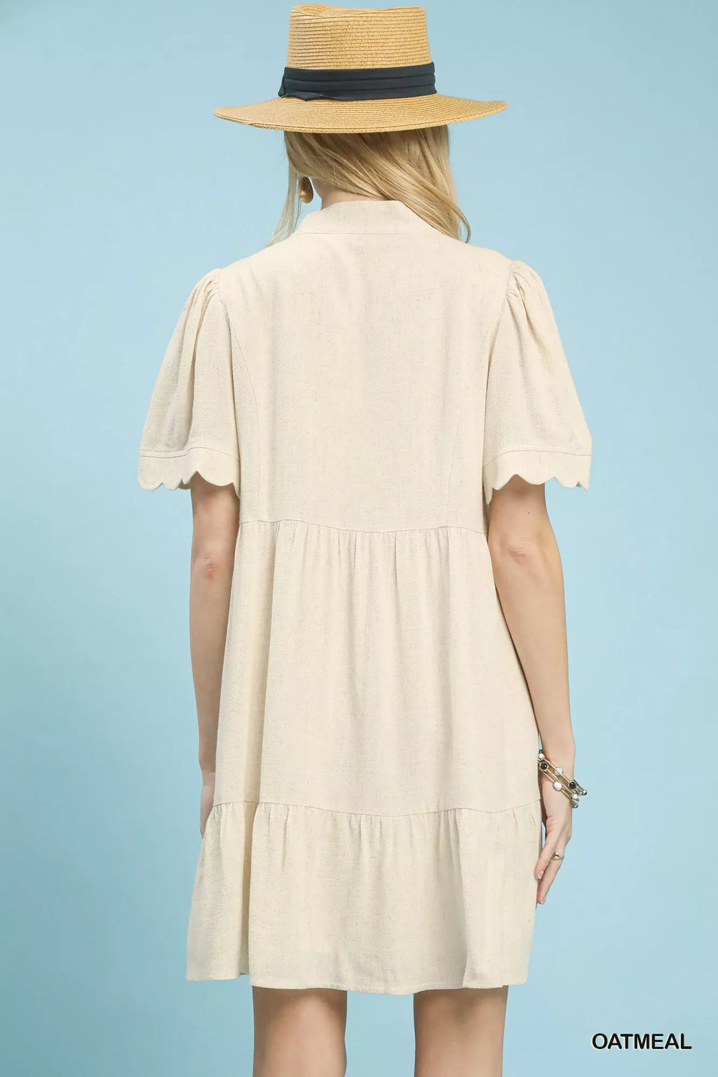 Umgee Linen Tiered Babydoll Dress with Scalloped Sleeves back of dress blue background