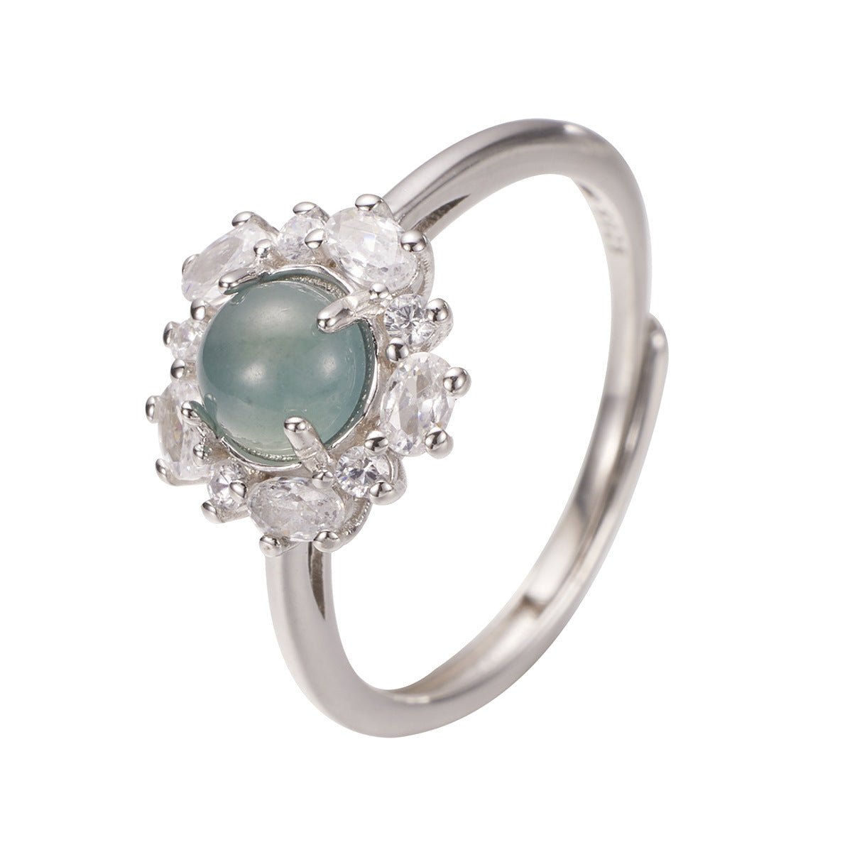 Silver ring with a central green gemstone and diamond-like stones on a white background
