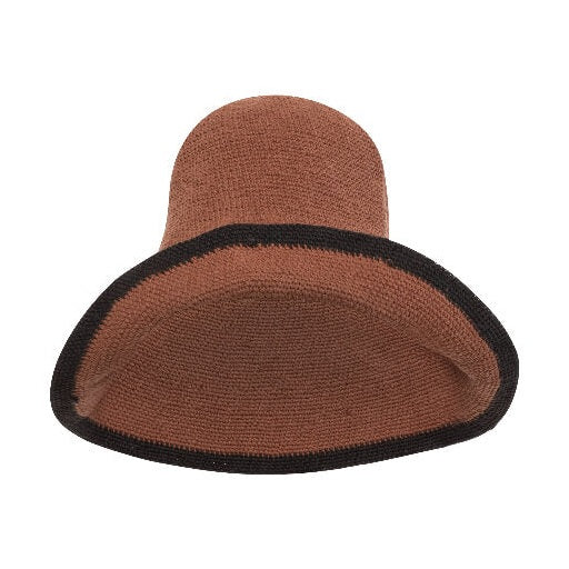 Flat lay of dark brown textured crochet sun hat with black brim edge