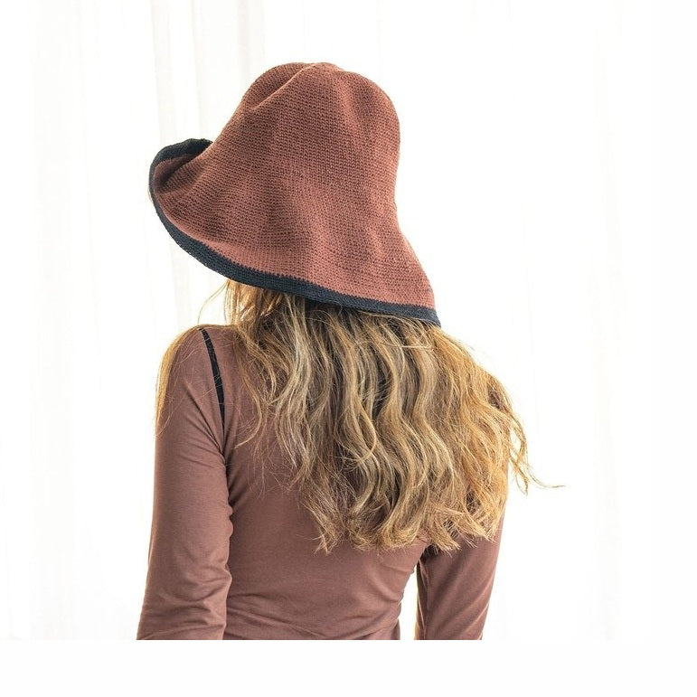 Side view of dark brown crochet sun hat with black trim detail