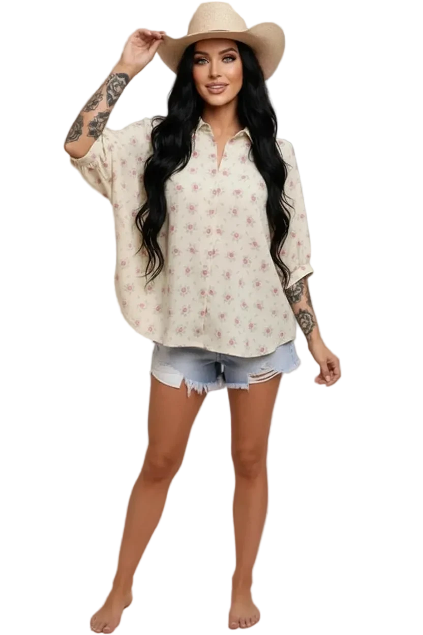 Woman wearing a floral blouse with pink ground.