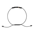 Black beaded bracelet on a white background