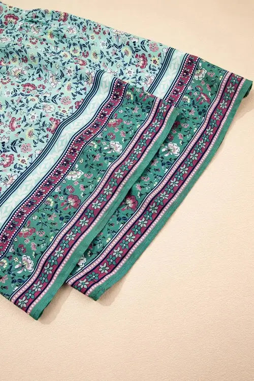 Close-up of a floral-patterned fabric with a beige background