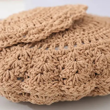 Close-up of a brown knitted fabric on a white background