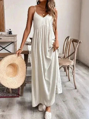 Cream spaghetti strap maxi dress with ruched waist and V-neck