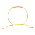 Yellow beaded bracelet on a white background