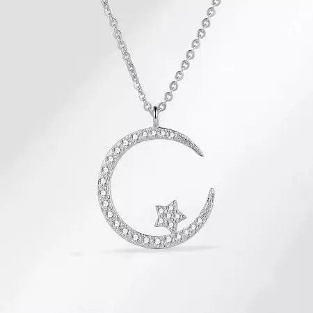 Silver crescent moon star pendant necklace with clear stone accents