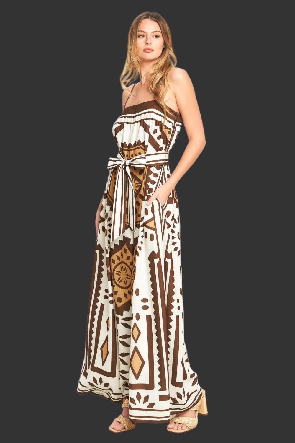 Woman wearing a patterned dress on a white background