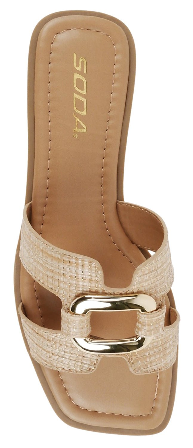 Beige sandal with a gold buckle on a white background