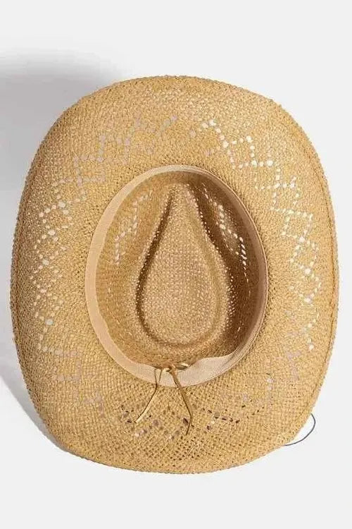 Interior view of tan woven straw hat with beige fabric sweatband