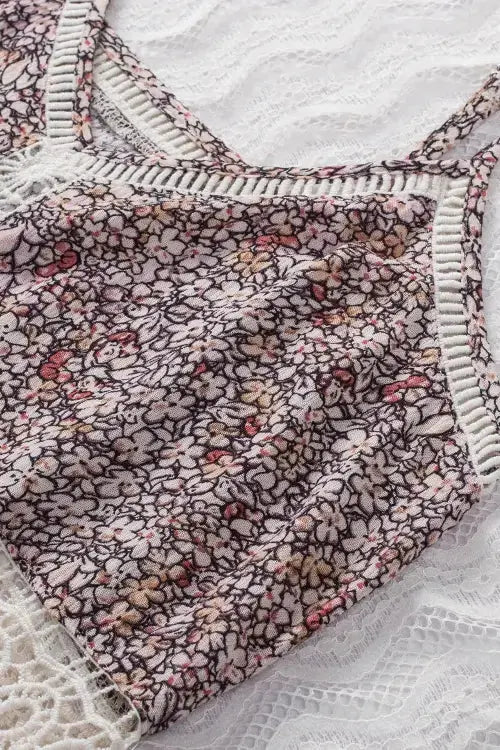 Floral patterned fabric with white trim on a textured surface