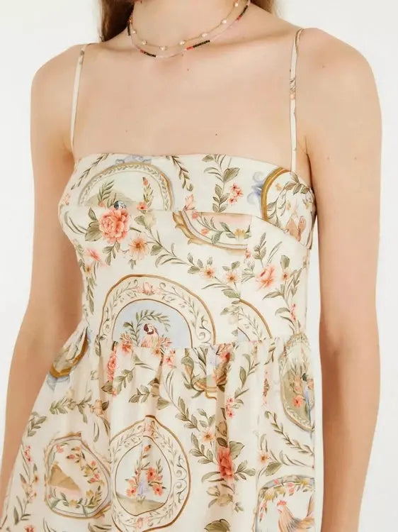 Floral and paisley patterned dress on a white background