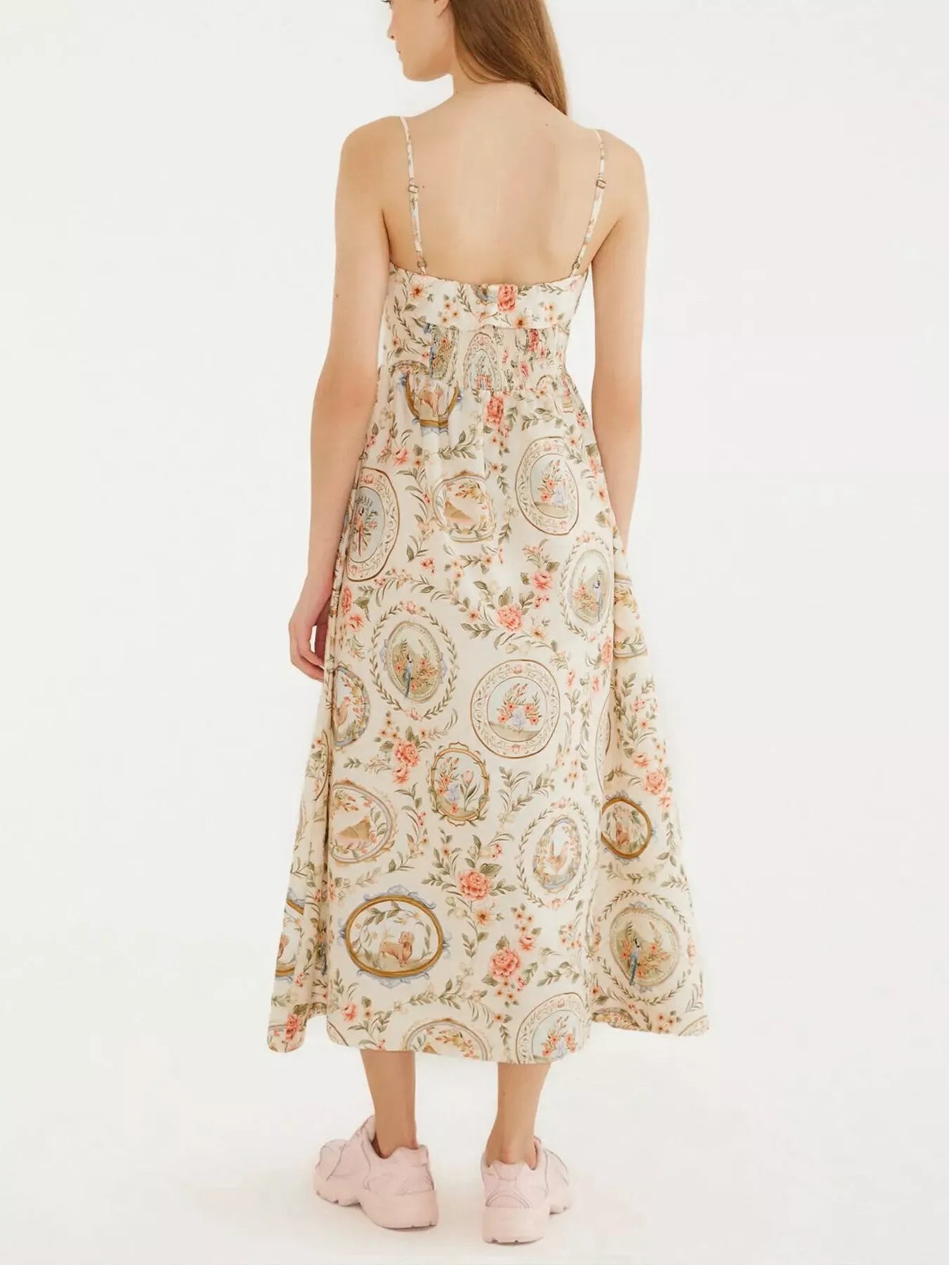 Woman wearing a floral dress on a white background