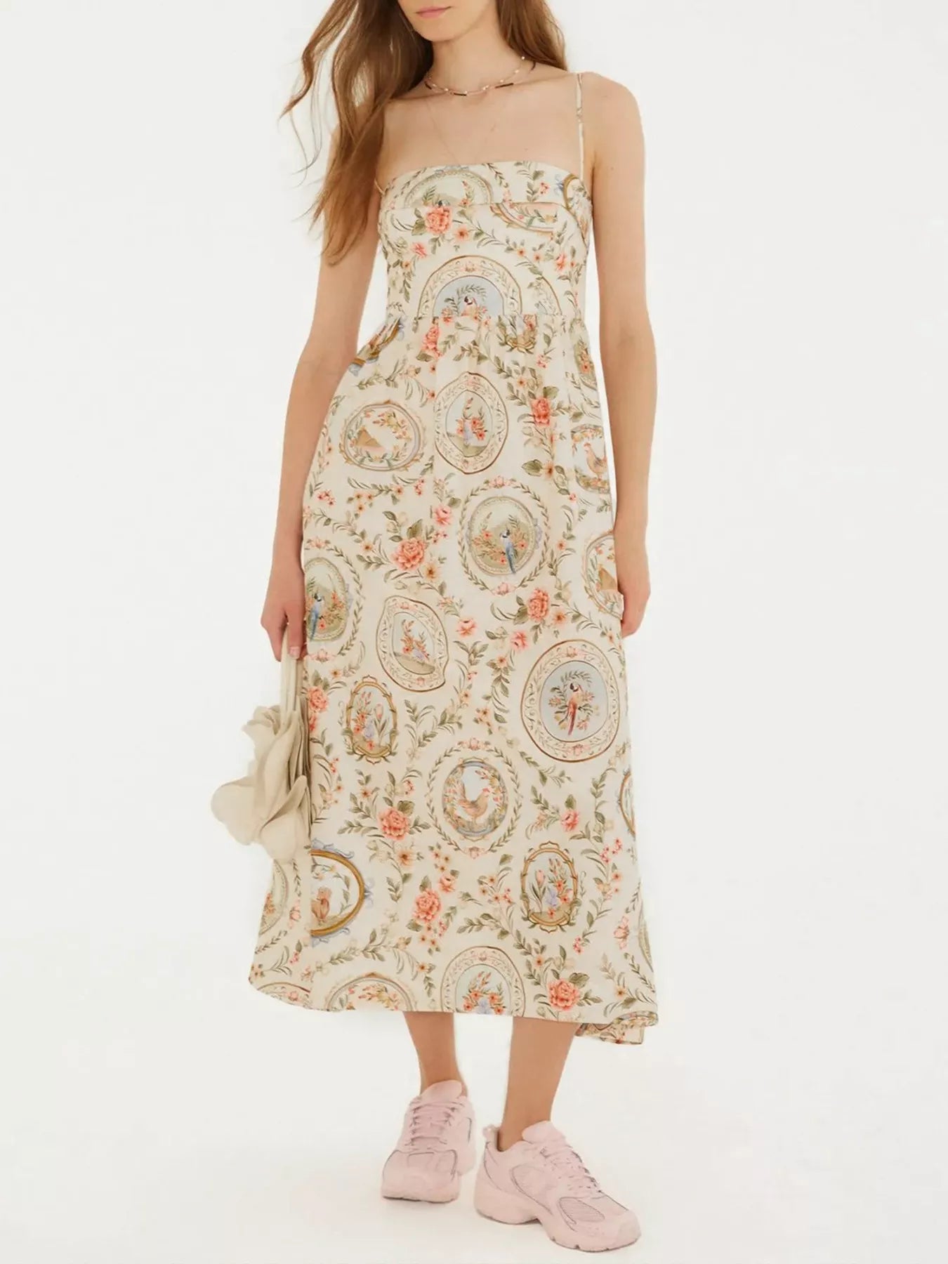 Woman wearing a floral dress on a white background