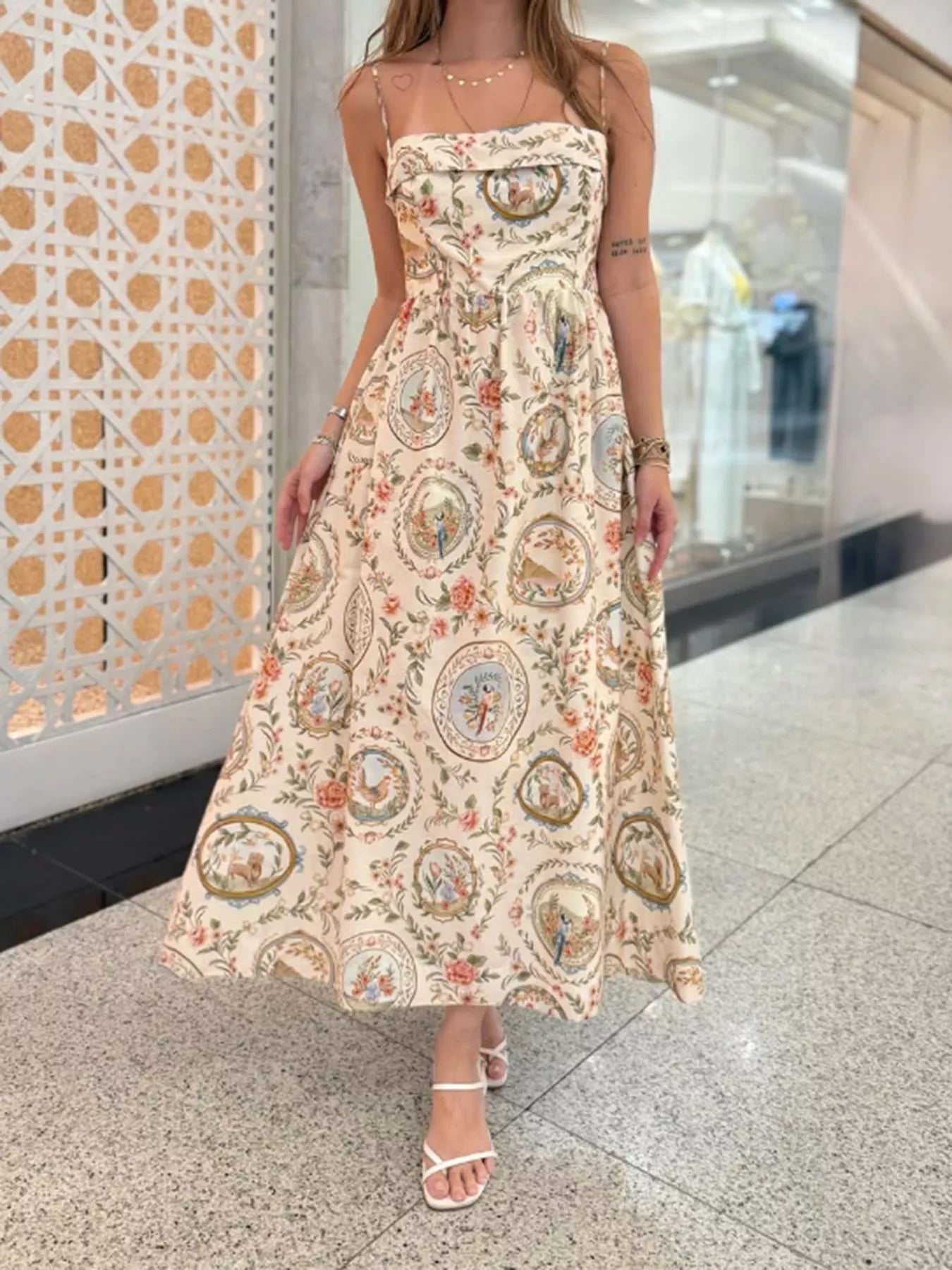 Woman wearing a floral dress in an indoor setting