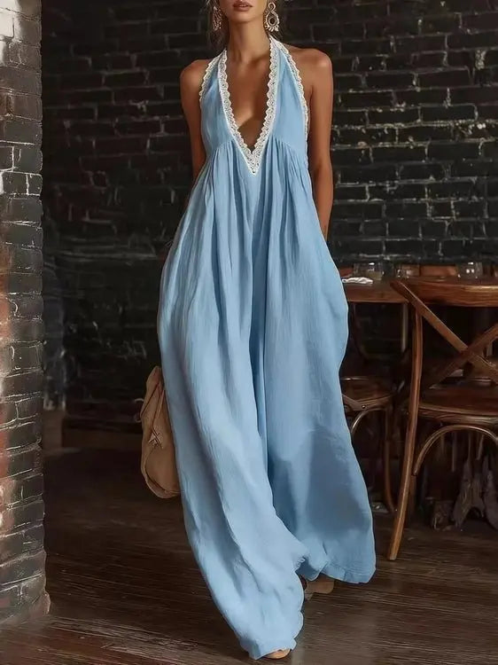 Light blue full length halter jumpsuit with lace trim on straps