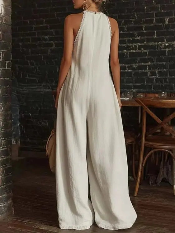 White halter jumpsuit back view with lace trim and wide leg fit