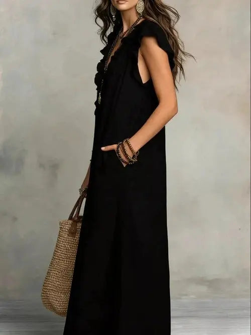 Black full-size ruffled V-neck cap sleeve maxi dress hand in pocket