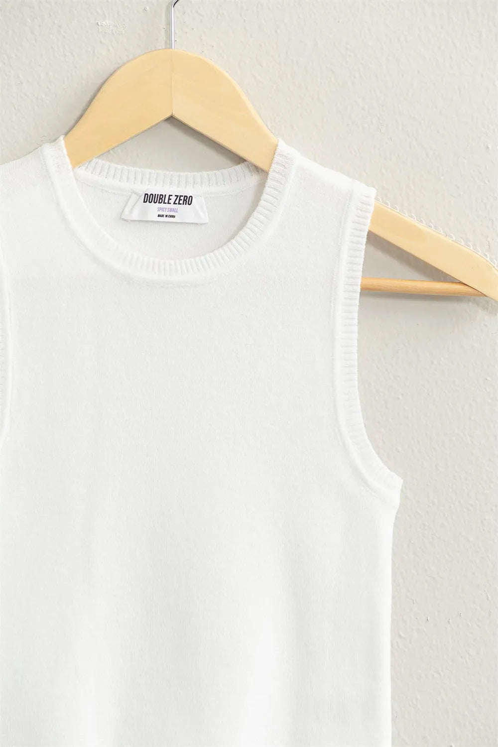 White ribbed knit cropped tank top close-up of neckline and DOUBLE ZERO label