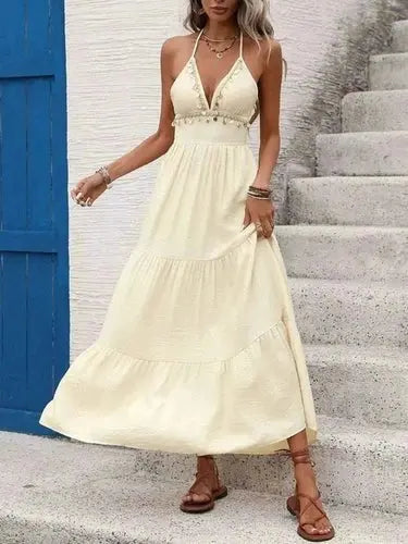 Cream halter neck tiered maxi dress with shell embellishments and smocked waist