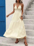 Cream halter neck tiered maxi dress with shell embellishments and smocked waist