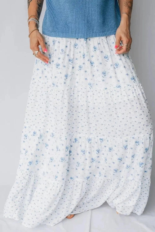White floral skirt with blue flowers on a plain background