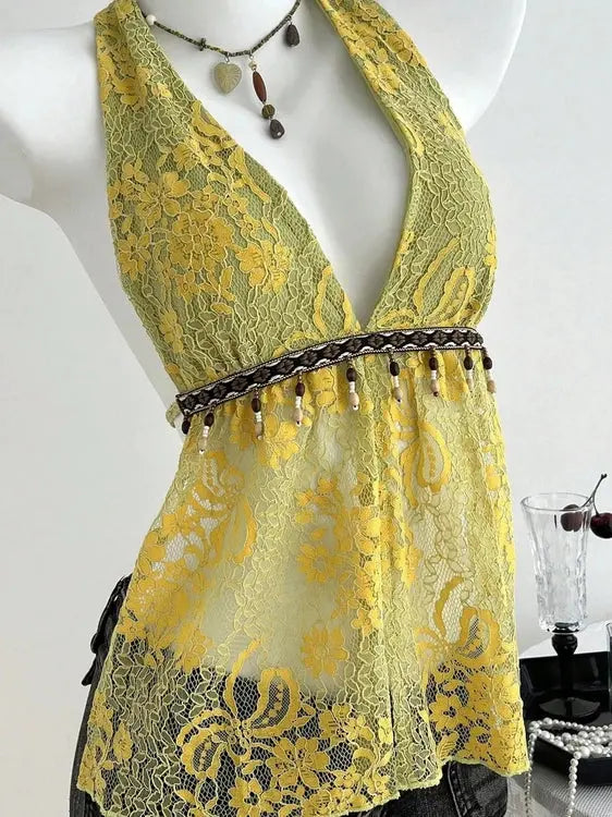 Yellow green floral lace halter top featuring dangling bead waist detail