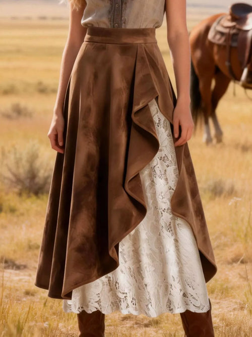 Person wearing a brown and white dress with a horse in the background