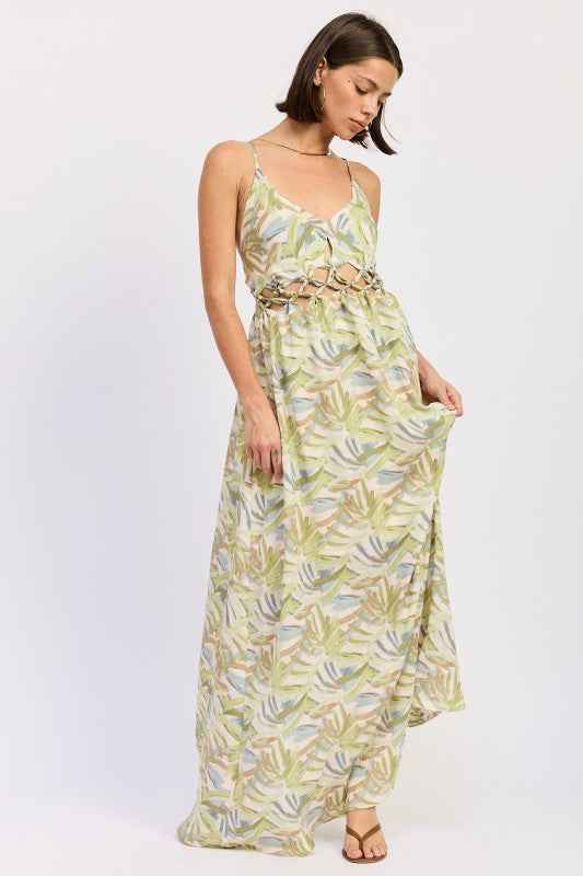 Woman wearing a long, floral-patterned dress on a white background