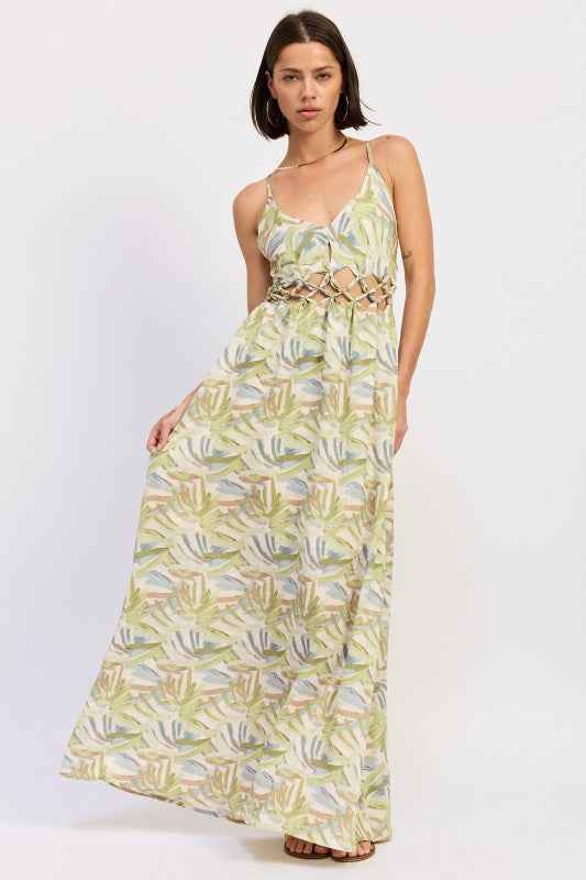 Model wearing floral open‑back maxi dress for warm‑weather boho style.