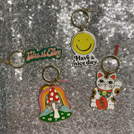 Set of four whimsical charms including mushroom keychain