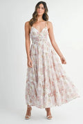 Woman wearing a floral dress on a white background