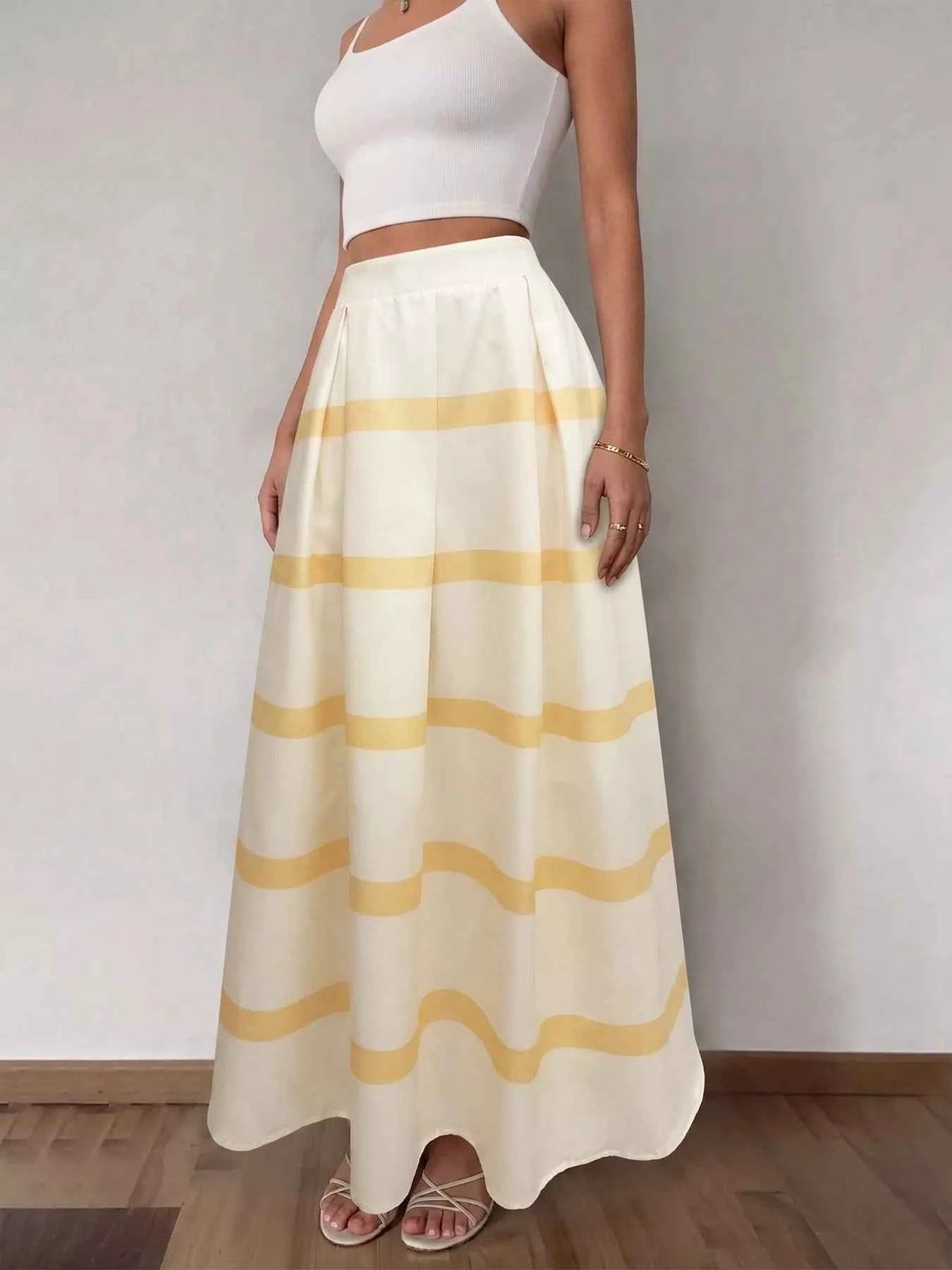 Person wearing a white top and yellow striped skirt against a plain background