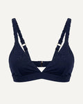 Navy blue bikini top with thin straps on a light gray background