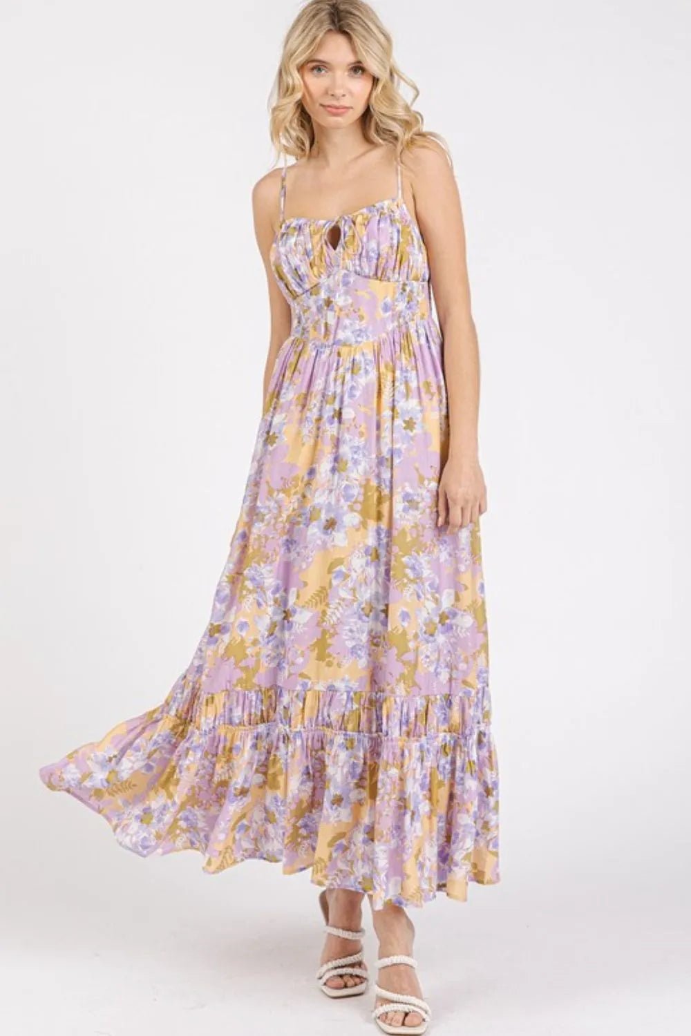 Woman wearing a floral dress on a white background