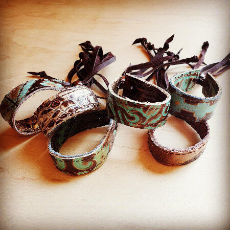 Set of patterned bracelets on a wooden surface
