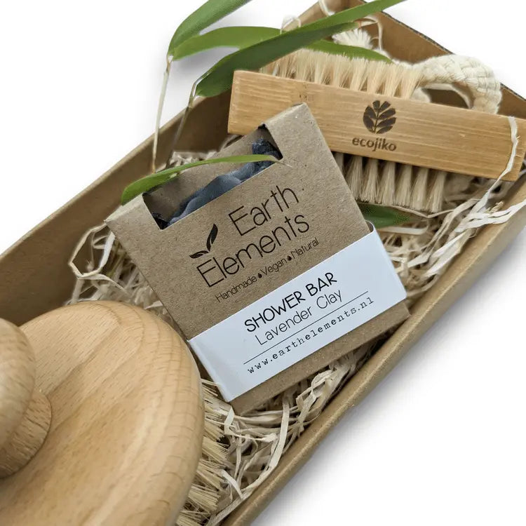 Open eco-friendly bathroom gift set featuring natural wood brushes and handmade shower bar