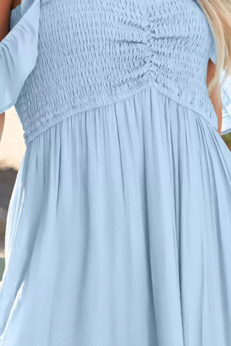 Light blue dress with smocked waist and flowing skirt