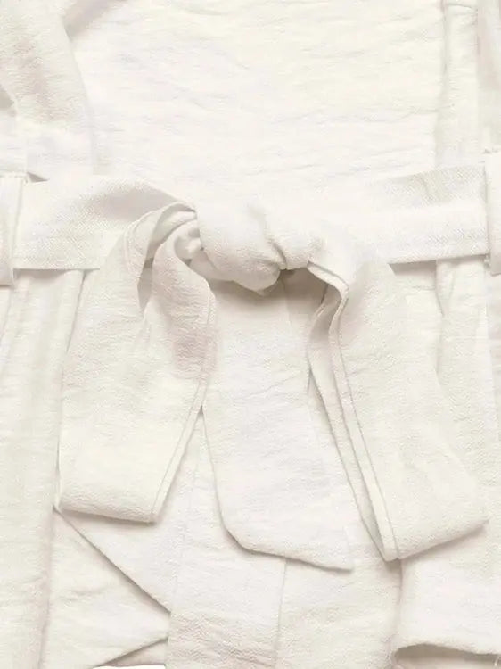 Close-up of white fabric with a textured pattern