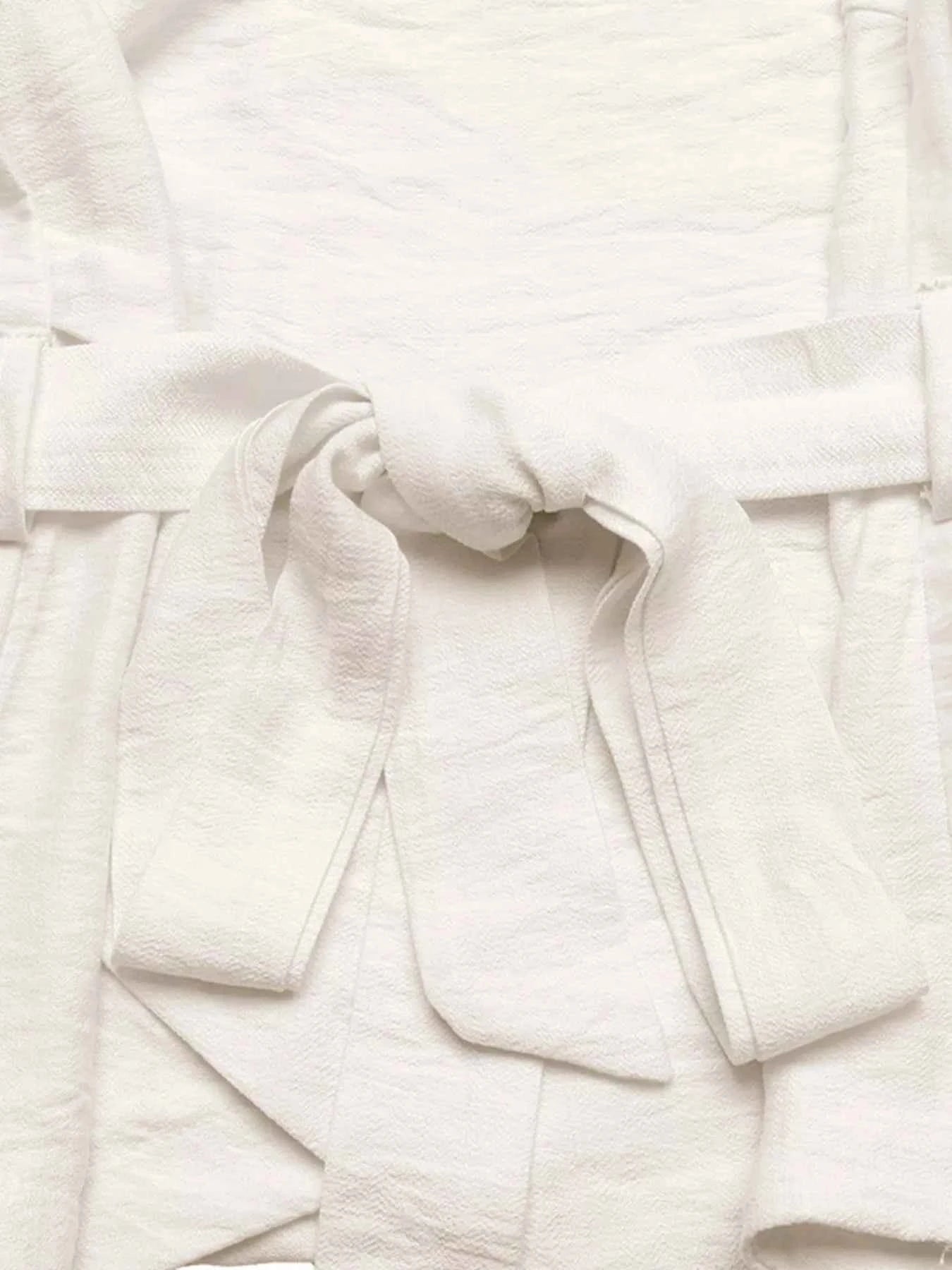 Close-up of white fabric with a textured pattern