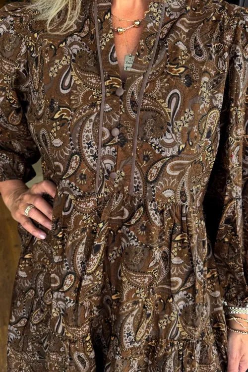 Brown patterned dress worn by a person