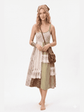 Woman wearing a patchwork dress with a brown bag on a white background