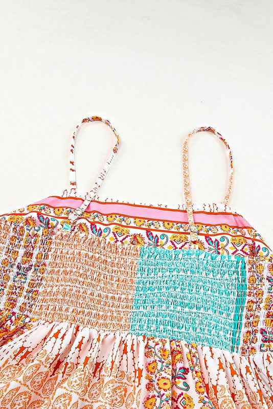 Colorful patterned dress with floral design on a white background