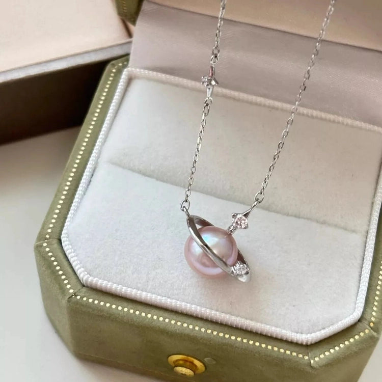 Pinkish-white pearl planet pendant necklace in olive velvet jewelry box