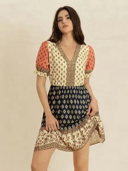 Woman wearing a patterned dress with a beige background