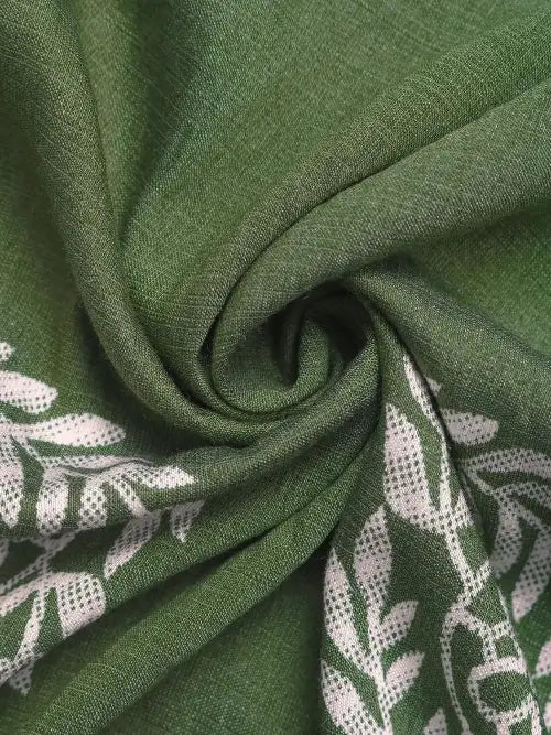 Close-up of green fabric with white leaf pattern