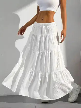 White boho chic tiered maxi skirt flaring during movement