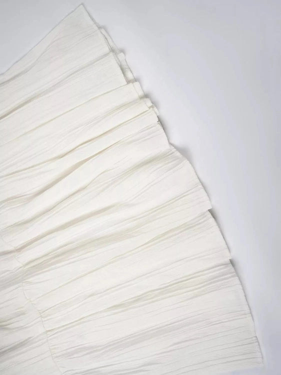 White Ruched tiered fabric on white table