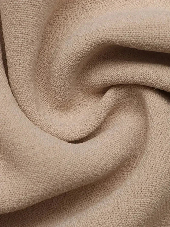 Close-up of beige fabric with a textured pattern